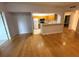 An open-concept living area features hardwood floors and an attached kitchen at 5125 Palm Springs Blvd # 1203, Tampa, FL 33647