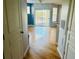 Bright living room featuring hardwood floors, sliding glass doors to balcony, and neutral paint at 5125 Palm Springs Blvd # 1203, Tampa, FL 33647