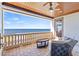 Relaxing balcony with outdoor seating offers expansive views of the ocean at 5128 W Longfellow Ave, Tampa, FL 33629