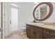 Bathroom featuring granite countertops and a built-in vanity at 5128 W Longfellow Ave, Tampa, FL 33629