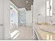 Spacious bathroom featuring a soaking tub, walk-in shower, and double vanity at 5128 W Longfellow Ave, Tampa, FL 33629