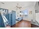 Charming bedroom with a bunk bed, a large window view of the water, and hardwood floors at 5128 W Longfellow Ave, Tampa, FL 33629