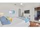 Bright bedroom featuring a desk and walkout access to a private patio at 5128 W Longfellow Ave, Tampa, FL 33629