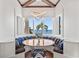 Charming breakfast nook with bay windows and banquette seating offers stunning ocean views at 5128 W Longfellow Ave, Tampa, FL 33629