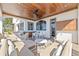 Spacious covered patio with ceiling fan, recessed lights, and a wet bar, perfect for enjoying the waterfront view at 5128 W Longfellow Ave, Tampa, FL 33629
