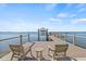 Charming dock featuring Adirondack chairs, a small table, and serene water views, ideal for relaxing and enjoying the scenery at 5128 W Longfellow Ave, Tampa, FL 33629