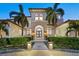 Beautiful home featuring manicured landscaping, elegant stonework, and a grand entrance at 5128 W Longfellow Ave, Tampa, FL 33629
