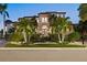 Beautiful Mediterranean-style home with professional landscaping and exterior illumination at 5128 W Longfellow Ave, Tampa, FL 33629