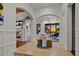 Beautiful foyer with arched doorway and fireplace with water view at 5128 W Longfellow Ave, Tampa, FL 33629