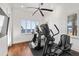 Home gym featuring cardio equipment, hardwood floors and a view at 5128 W Longfellow Ave, Tampa, FL 33629