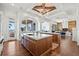 Open-concept kitchen with wood cabinets, white countertops, brick flooring, and stunning ocean views at 5128 W Longfellow Ave, Tampa, FL 33629