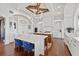 Modern kitchen with double islands, white cabinets and modern lighting at 5128 W Longfellow Ave, Tampa, FL 33629