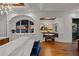 Spacious kitchen with white countertops, wood floors, and stunning ocean sunset views at 5128 W Longfellow Ave, Tampa, FL 33629