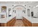 Spacious kitchen with dual kitchen islands featuring wood cabinets and white countertops at 5128 W Longfellow Ave, Tampa, FL 33629