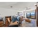 Comfortable living room with a desk, a leather couch, and a balcony overlooking the water at 5128 W Longfellow Ave, Tampa, FL 33629