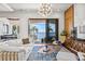 Bright living room with water views featuring a modern chandelier and wood accents at 5128 W Longfellow Ave, Tampa, FL 33629