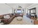 Spacious living room with sectional sofa, ceiling fan, and views of the ocean at 5128 W Longfellow Ave, Tampa, FL 33629