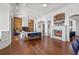 Spacious living room features wood floors, a cozy fireplace, and bright decor at 5128 W Longfellow Ave, Tampa, FL 33629