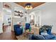 Spacious living room offers a fireplace, beautiful arches, and comfortable seating at 5128 W Longfellow Ave, Tampa, FL 33629