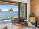 Living area with patio access featuring water views, and comfortable seating at 5128 W Longfellow Ave, Tampa, FL 33629