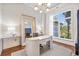 Bright and airy office space with neutral wallpaper, large windows, and a modern desk at 5128 W Longfellow Ave, Tampa, FL 33629