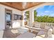 Inviting outdoor living space with a TV, grill, and comfortable seating, perfect for relaxing and entertaining at 5128 W Longfellow Ave, Tampa, FL 33629