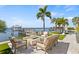 Relaxing outdoor living area with a fire pit, lush landscaping, and boat docks, perfect for enjoying the waterfront at 5128 W Longfellow Ave, Tampa, FL 33629
