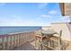 Inviting outdoor patio with a table and chairs overlooking a tranquil view of the water at 5128 W Longfellow Ave, Tampa, FL 33629