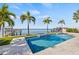 Stunning backyard featuring a pool and spa surrounded by tropical landscaping, perfect for relaxation and entertainment at 5128 W Longfellow Ave, Tampa, FL 33629