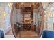 Oval wine cellar featuring beautiful wood finishes and ample wine storage at 5128 W Longfellow Ave, Tampa, FL 33629