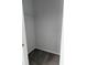 Compact walk-in closet featuring gray carpet and a single wire shelf at 5904 Willow Ridge Dr # 202, Zephyrhills, FL 33541