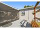 Outdoor patio with seating area, connected to a screened in sunroom at 6202 Tennessee Ave, New Port Richey, FL 34653