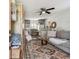 Cozy living room featuring a comfortable couch, ceiling fan, and decorative rug at 6202 Tennessee Ave, New Port Richey, FL 34653