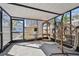 Enclosed patio with hanging chair and natural light at 6202 Tennessee Ave, New Port Richey, FL 34653