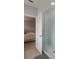 Modern bathroom showcasing a glass-enclosed shower with subway tile and a view into the bedroom at 6615 S Manhattan Ave # 2, Tampa, FL 33616
