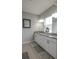Spacious bathroom featuring a double vanity with granite countertops and ample storage at 6615 S Manhattan Ave # 2, Tampa, FL 33616