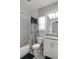 Full bathroom featuring patterned tile floors, shower with tile surround and granite vanity at 6615 S Manhattan Ave # 2, Tampa, FL 33616