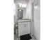 Bathroom with white cabinets, granite countertops, patterned floors, and light fixtures at 6615 S Manhattan Ave # 2, Tampa, FL 33616