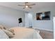 Bedroom with ceiling fan, large television, walk-in closet and ensuite bathroom at 6615 S Manhattan Ave # 2, Tampa, FL 33616