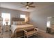 Bright bedroom with plush carpeting and a tufted headboard with decorative pillows at 6615 S Manhattan Ave # 2, Tampa, FL 33616