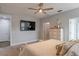 Spacious bedroom features a ceiling fan, walk-in closet and mounted television at 6615 S Manhattan Ave # 2, Tampa, FL 33616