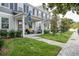 Inviting townhouse with a cozy porch and well-maintained landscaping at 6615 S Manhattan Ave # 2, Tampa, FL 33616