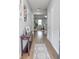 Inviting hallway with hardwood floors and stylish decor, leading to a cozy living area at 6615 S Manhattan Ave # 2, Tampa, FL 33616