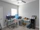 This office features multiple monitors, a glass desk and is brightly illuminated with natural light at 6615 S Manhattan Ave # 2, Tampa, FL 33616
