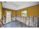 Bedroom with exposed studs and a ceiling fan, awaiting customization at 6713 S Mascotte St, Tampa, FL 33616