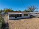 Aerial view of the back of the house featuring a screened in patio at 7305 Windsor St, Hudson, FL 34667