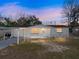 Charming single-story home featuring a carport, front yard, and freshly painted exterior at 7305 Windsor St, Hudson, FL 34667