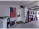 Garage interior featuring storage shelves, laundry supplies, and access to the house at 7305 Windsor St, Hudson, FL 34667
