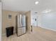 Kitchen with stainless steel refrigerator and access to dining area at 7305 Windsor St, Hudson, FL 34667