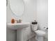 Clean powder room with pedestal sink and modern fixtures at 7446 Yale Harbor Dr, Wesley Chapel, FL 33545